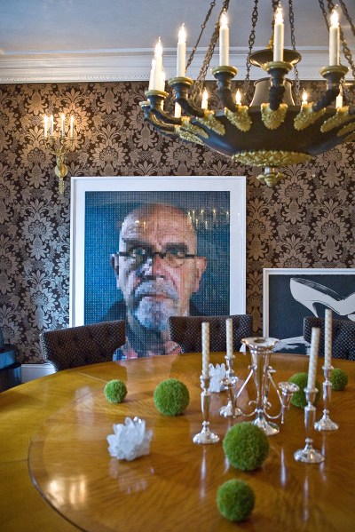 A Chuck Close self-portrait leans against the wall of the dining room. Photo by Emily Anne Epstein.