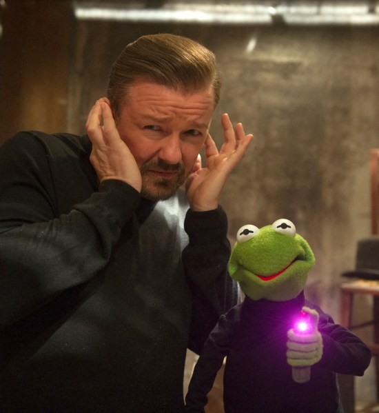 Ricky Gervais, as Dominic Badguy, alongside a Kermit impersonator in Muppets Most Wanted.