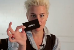 Ms. Cheeks and a Cheek'd card (Screengrab: YouTube)