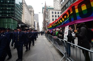 Gay rights supporters protest yesterday's St. Patrick's Day Parade with a banner reading: "BAN HOMOPHOBIA!" (Photo: Emmanuel Dunand/Getty)