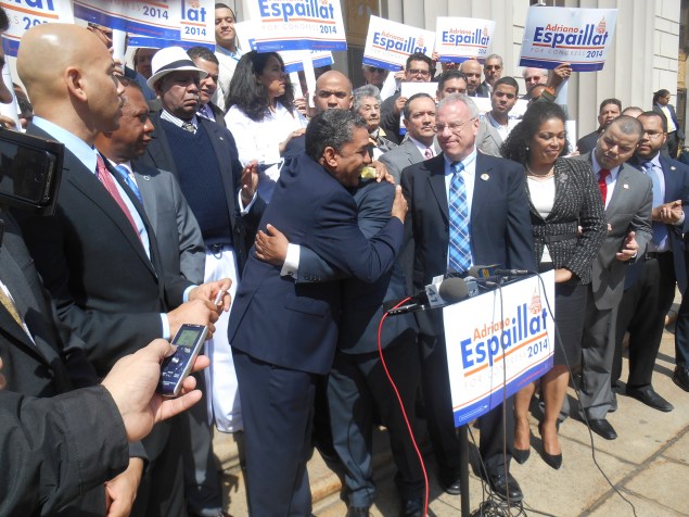 State Senator Adriano Espaillat embraces the Bronx Democratic chairman as Bronx Borough President Rubén Díaz, Jr. looks on (right).