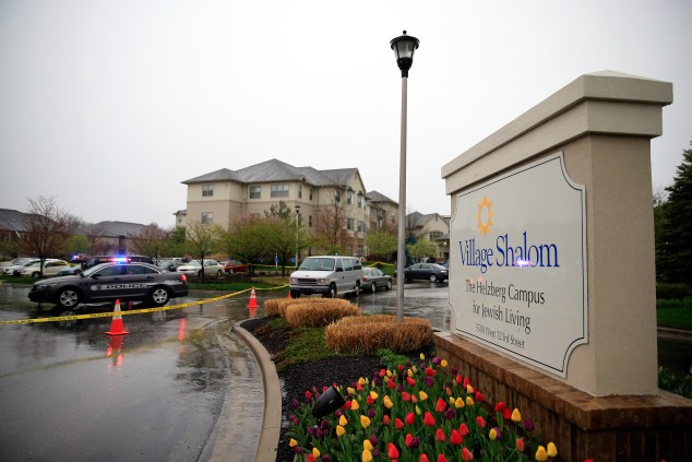 Police cars sit outside Village Shalom, the senior living center where one of three victims was killed. (Photo: Jamie Squire/Getty)