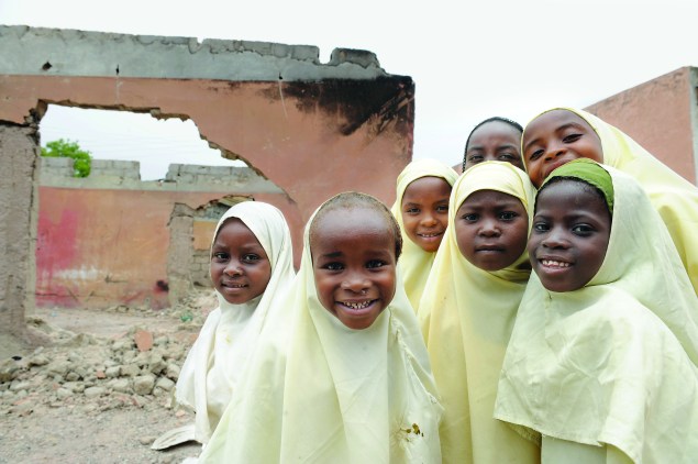 Young girls outside a school in Nigeria, where the militant anti-education group Boko Haram has kidnapped girls and vowed to sell them into slavery. 