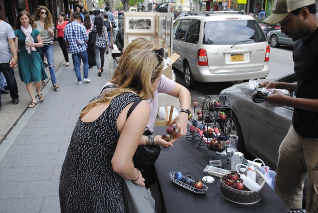 A street vendor sells egg shell plant holders.