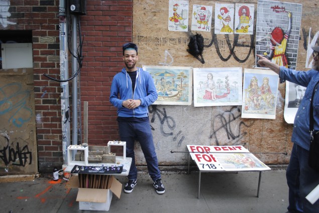 A vendor uses a "For Rent" sign to set up shop.