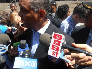Councilman Ruben Wills in a media scrum.