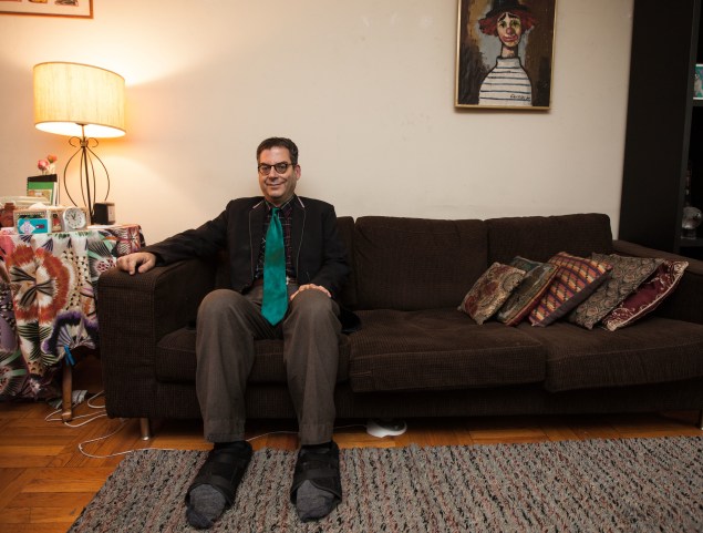 Michael Musto at home in his Murray Hill apartment. (Photo by Emily Assiran)