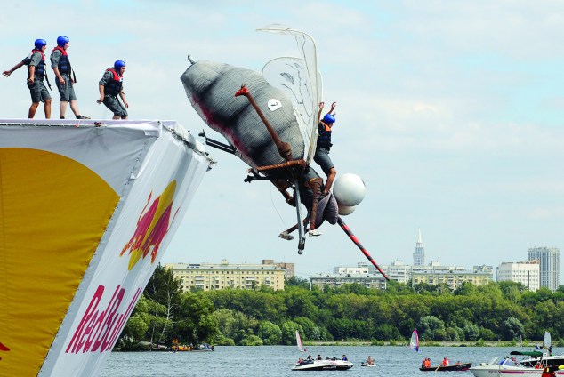 Russian competitors take part at the Red Bull 'Flugtag' event in Moscow on August 7, 2011. 38 teams took part at the Flugtag - which means 'flying day' - a competition in which teams in fancy dress attempt to pilot human-powered, home-made flying machines off a six-metre-high platform into water. (Photo: NATALIA KOLESNIKOVA/AFP/Getty Images)