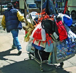 An example of a "canner" who collects recyclables off the street for a $0.05 refund. (Flickr)