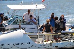 Mr. Morales (in the sunglasses) looks on as the media engages the couple. Photo: Dashel Pierson