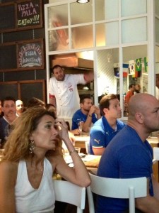One of Ribalta's chefs takes a break to watch the game. (Marie Solis)