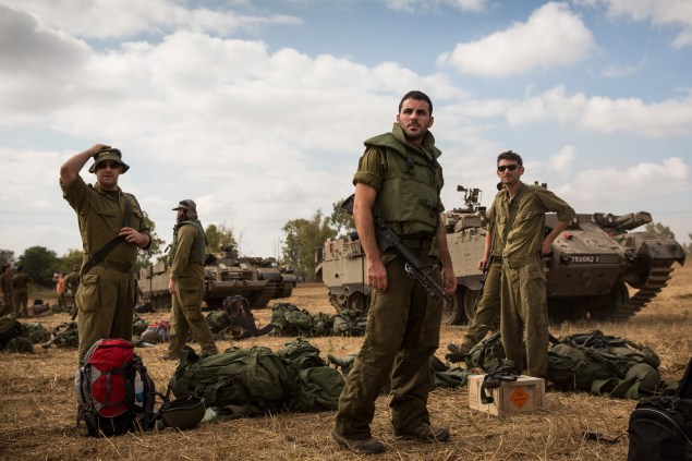 Israeli reservists troops arrive for duty near the Israel-Gaza border. (Photo via Getty Images)