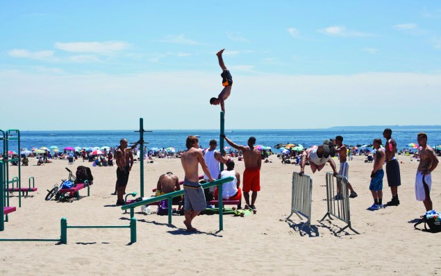 Waterfront acrobatics on the Coney Island beach. (Celeste Sloman)  