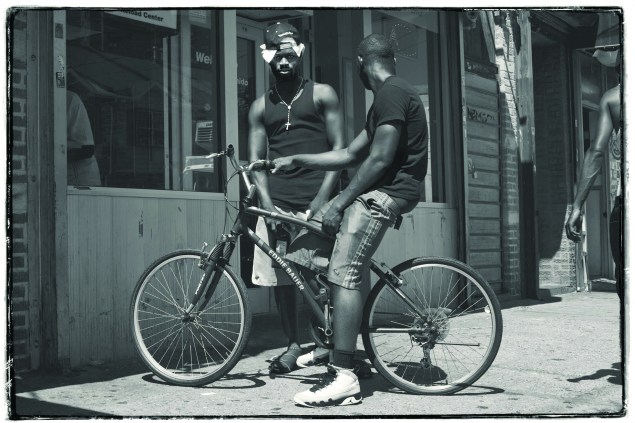Young men passing time on the street in Coney Island. (Celeste Sloman)
