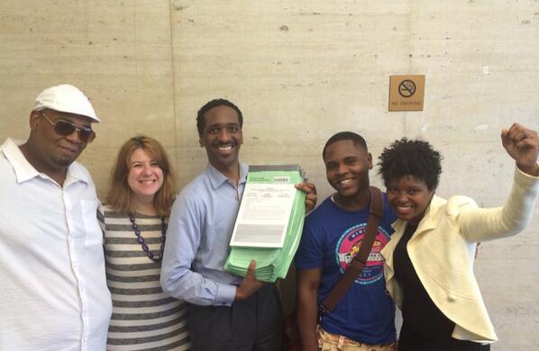 Rubain Dorancy shows off his ballot petitions with supporters.  (Photo: Twitter/@RubainDorancy)