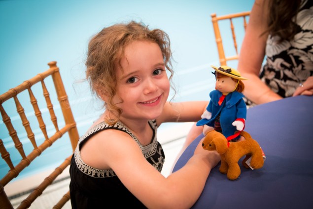 A girl with her Madeline doll at the special preview held last night. (Kaitlyn Flannagan)