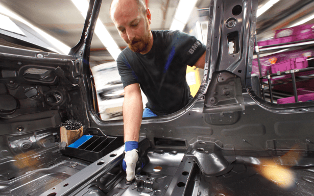 The thumbs are custom made for workers for the singular purpose of pushing down this rubber cap. (Photo via BMW)