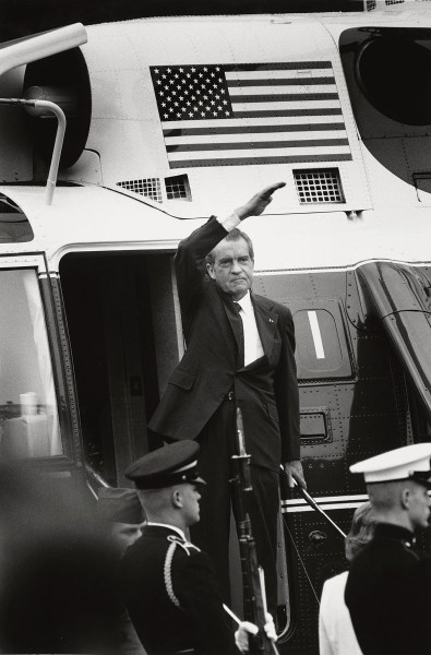 President Richard Nixon stands on the steps of the presidential helicopter as he waves goodbye. (Photo by David Hume Kennerly)