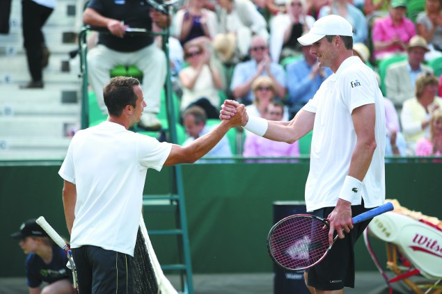 Germany's Philipp Kohlschreiber is a full foot shorter than Isner. (Photo by Jordan Mansfield/Getty Images)