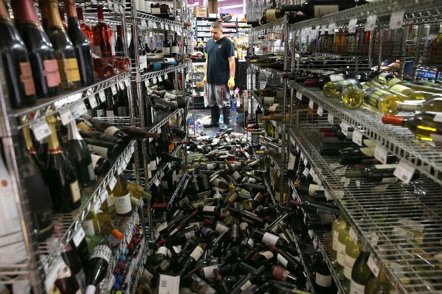 Wine bottles thrown from the shelves at a liquor store in Napa following an earthquake (Photo by Justin Sullivan/Getty Images)