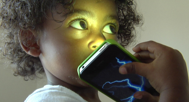 Mobilize asks us to consider what electromagnetic radiation might do to kids growing up with devices. (Photo via Mobilize)