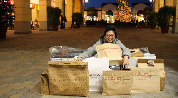 Another photo of Steve Tan with a pile of designer shopping bags. (Photo via Facebook)