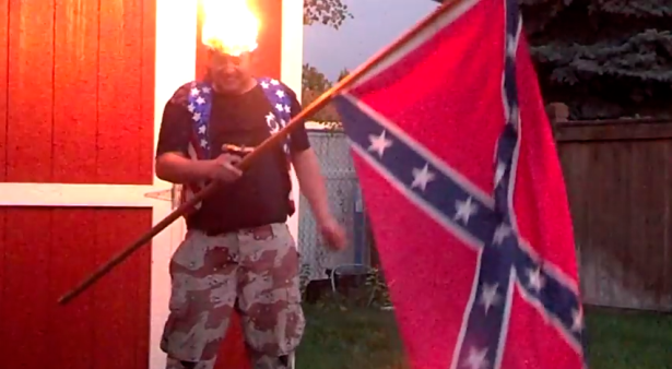 To be fair, we're pretty sure it's his hat that's in flames, and not his actual head. (YouTube)