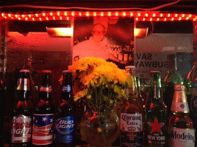 A portrait of the bar's first owner, Charles Ackerman, still hangs behind the bar. (Photo by Emma Hernandez)