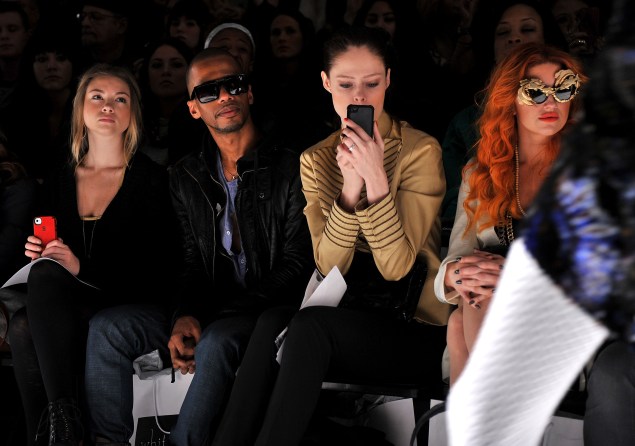 Ms. Rocha snaps a photo from the front row of the Fall 2012 Whitney Eve fashion show. (Photo via Getty)