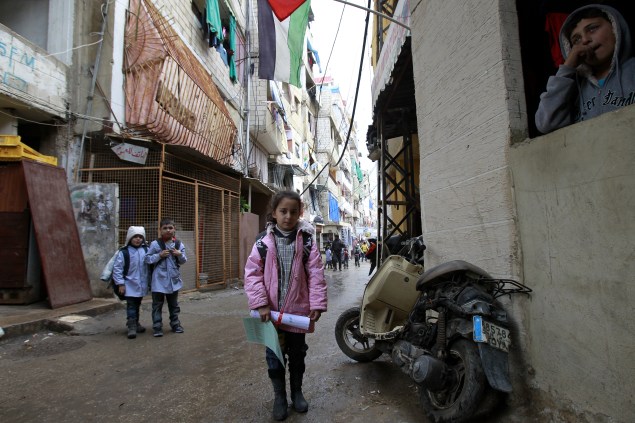 A Palestinian girl from the Syrian refugee camp of Yarmuk stands in a street at the Shatila refugee camp in the Lebanese capital Beirut. (Photo by ANWAR AMRO/AFP/Getty Images)