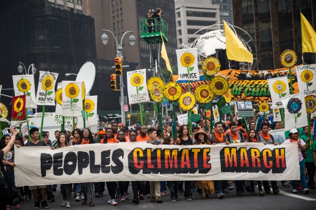 Protestors take to the street during the People's Climate March (Photo by Andrew Burton/Getty Images)