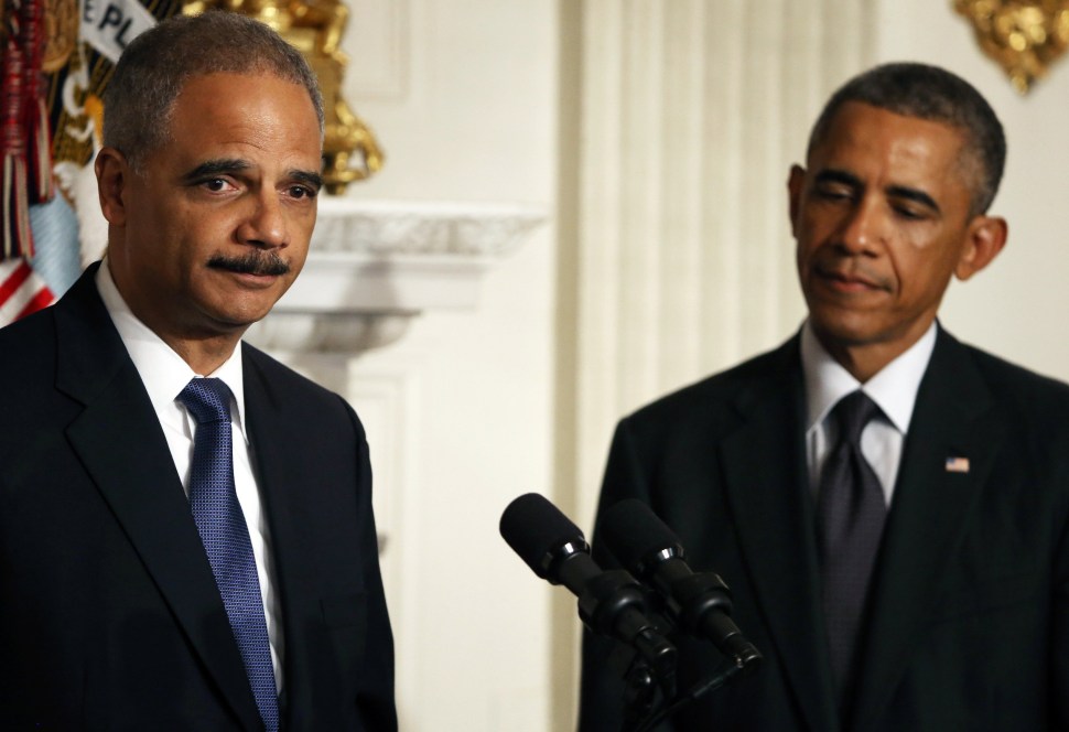Attorney General Eric H. Holder Jr. joins President Barack Obama while announcing his resignation, September 25, 2014 in Washington, DC. (Photo by Mark Wilson/Getty Images)