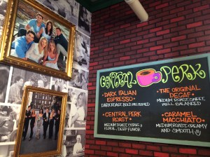 Central Perk chalkboard menu and photos of Friends cast.