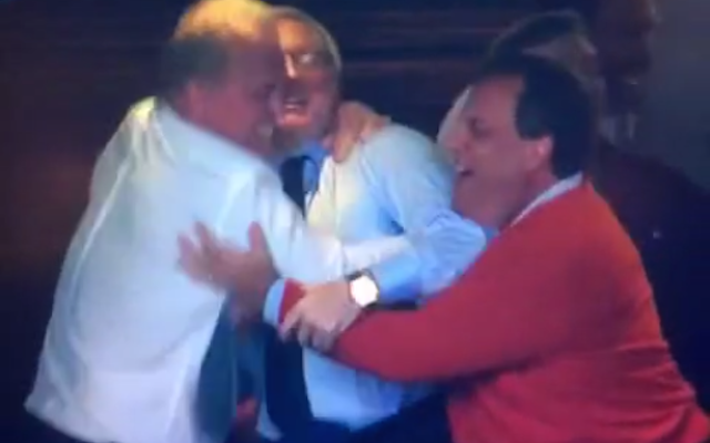 Screencap of Christie's awkward embrace (via FOX).
