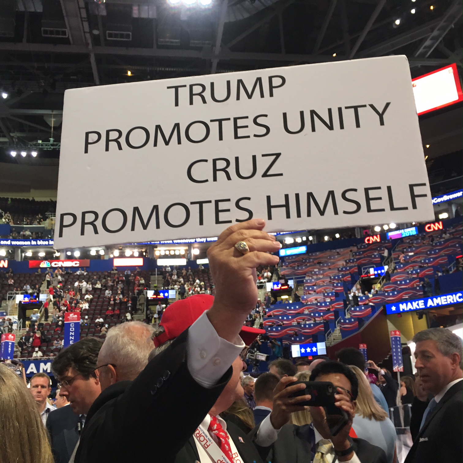 A delegate holds up an anti-Cruz sign. 