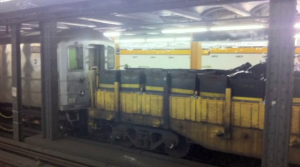 A train car hauls bags filled with subway trash (Photo: Al Barbarino) 