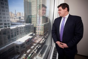 Tucker Reed, president of the Downtown Brooklyn Partnership, looking out of the window of the conference room at his offices at 1 MetroTech Center North