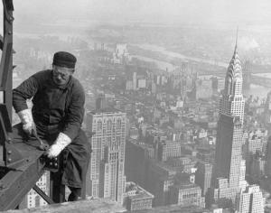 A worker atop the framework of the Empire State Building 