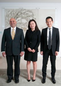 Mr. Grani, Ms. Cai-Lee and Mr. Do in front of "Peony in Full Bloom" by Cai Guo-Qiang, a contemporary Chinese mural made from gunpowder. (Photo by Michael Hicks)