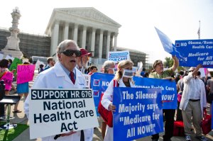 Demonstrators protesting on the Supreme Court steps in advance of the decision on the healthcare law. (Photo: Getty) 