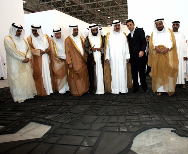 Sheikh Sultan Bin Mohammed Al Qasimi, the ruler of Sharjah, viewing a work by by Lebanese artist Marwan Rachmawi at the Sharjah Biennial 7 in 2005. (Courtesy Rabih Moghrabi/AFP/Getty Images)