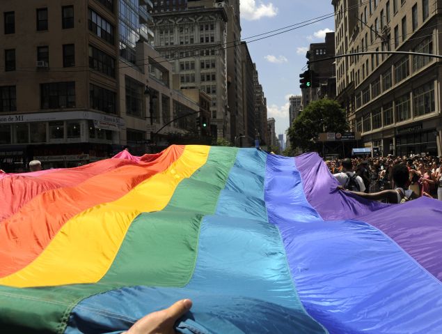 Marchers carry a rainbow flag down 5th Avenue during the 2012 New York Gay Pride parade. (Photo credit: TIMOTHY A. CLARY/AFP/Getty Images)