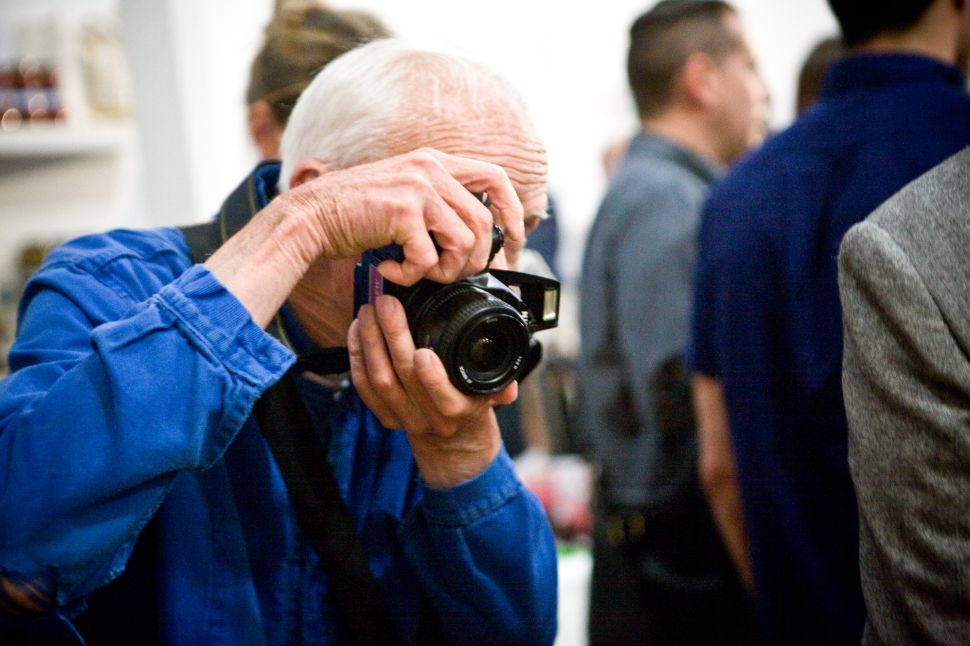 Bill Cunningham taking pictures in 2013