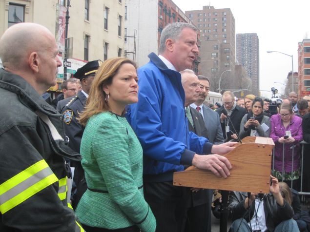 Speaker Melissa Mark-Viverito, standing beside the mayor at a briefing.
