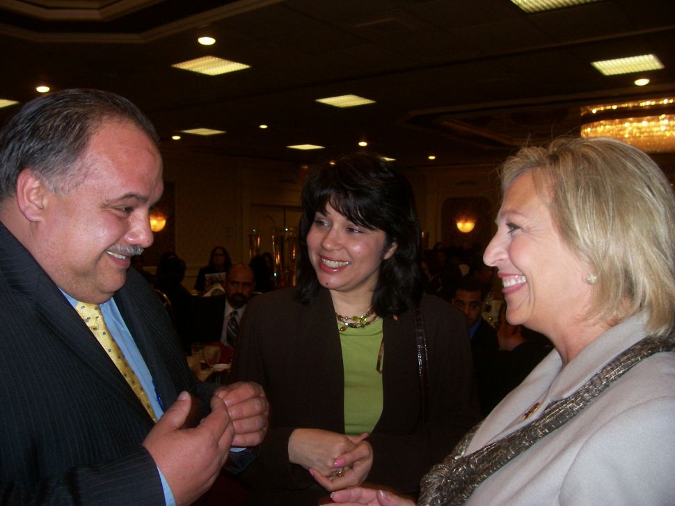Huttle, right, with veteran Newark Councilman Luis Quintana.