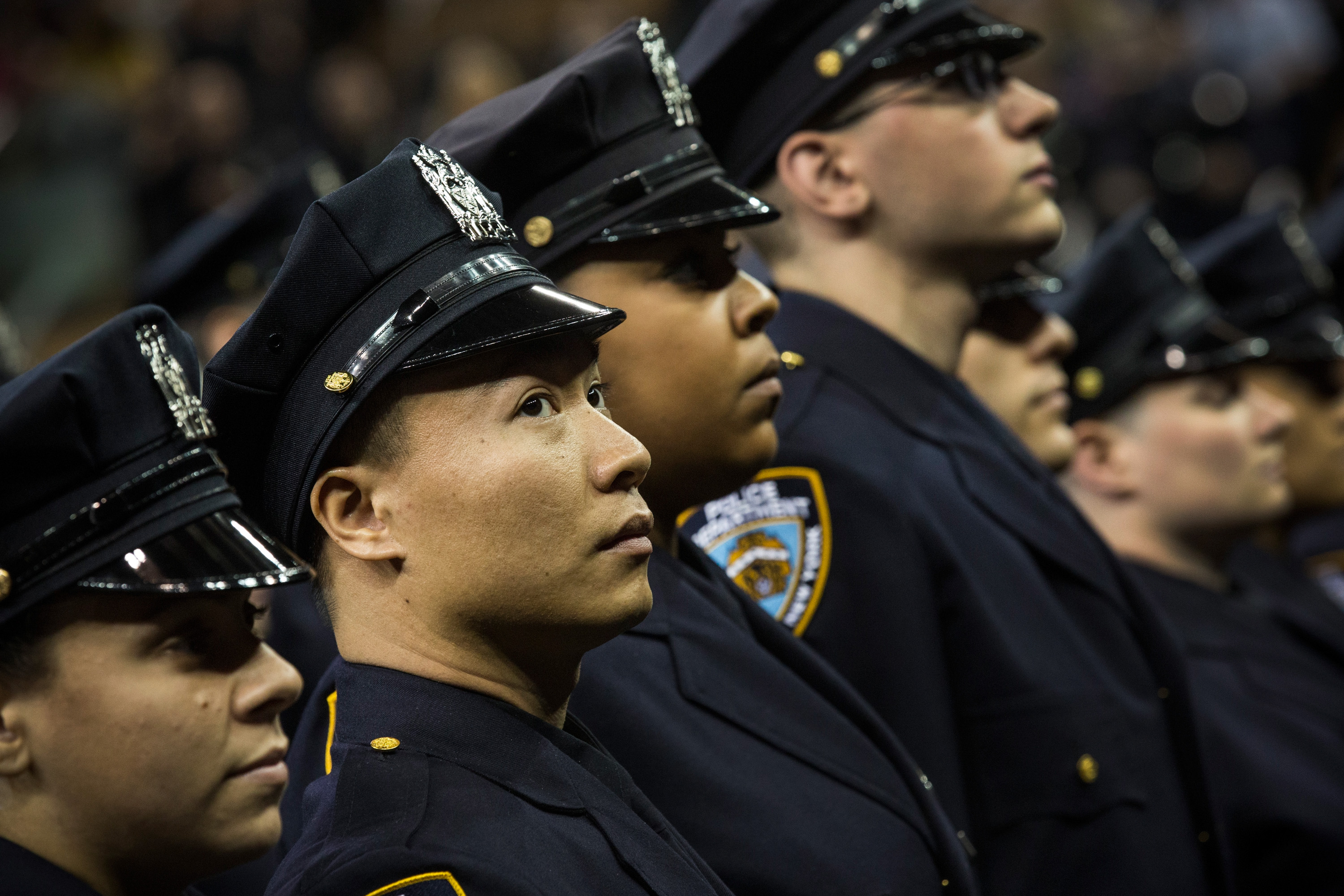 Members of a 2014 class of the New York Police Department. (Photo by Andrew Burton/Getty Images)