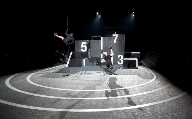 The runway, with parkour performers being lowered down just before their performance. (Photo via Getty)