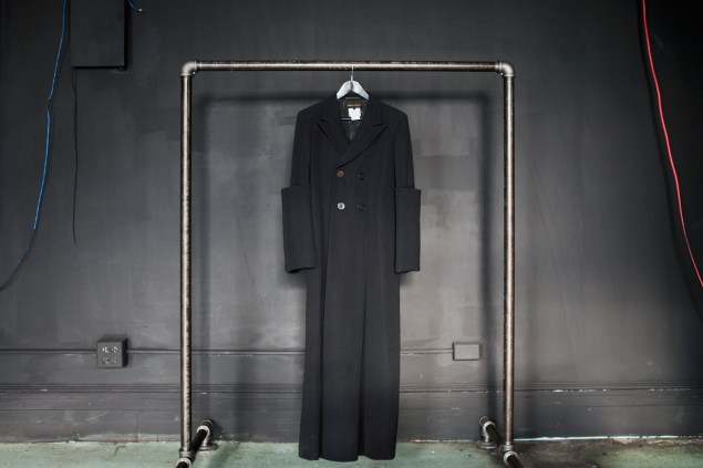A Comme des Garçons black coat from the 1990s at Byronesque.