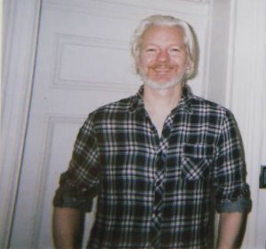 Assange with an Observer reporter in 2014. 