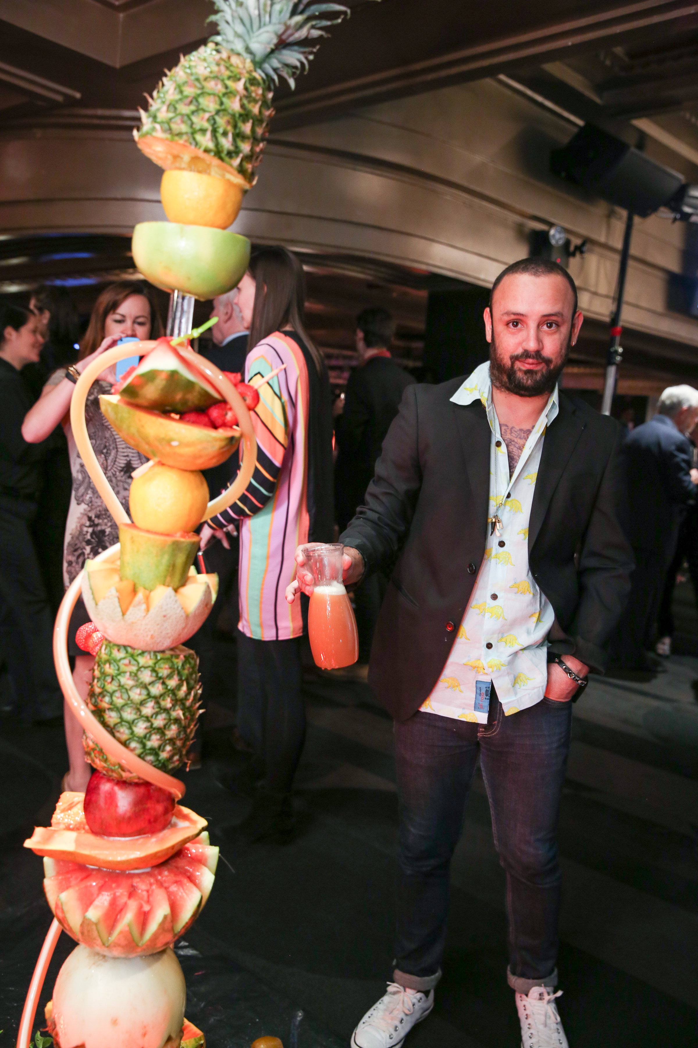 Juni Figueroa with his sculpture Never-Ending Tropical Fountain (Gala Edition) (Photo courtesy Billy Farrell)